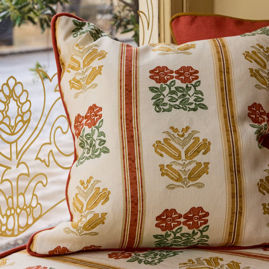 Folkloric Floral Print Cushion in Amber with Terracotta Piping