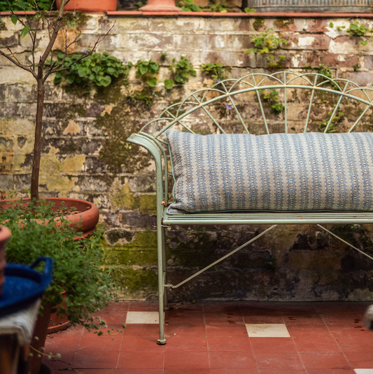 large bolster cushion in volga's petite kitezh weave with duck egg trim on bench