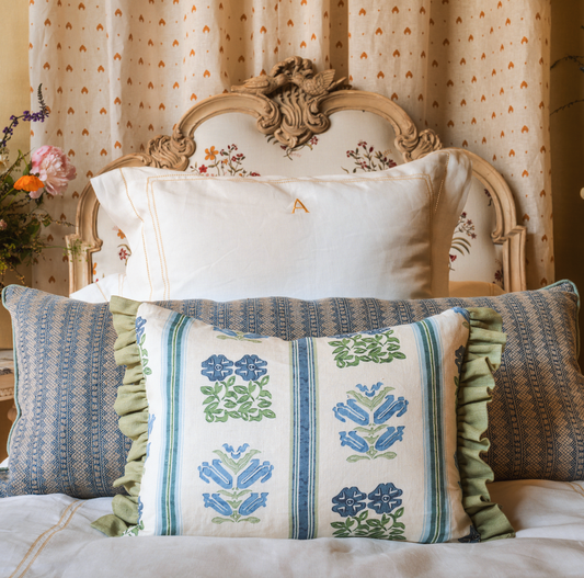 cushion in volga's folkloric floral print with eucalyptus trim