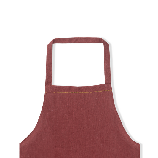 detail of marsala linen apron with ochre hemstitch