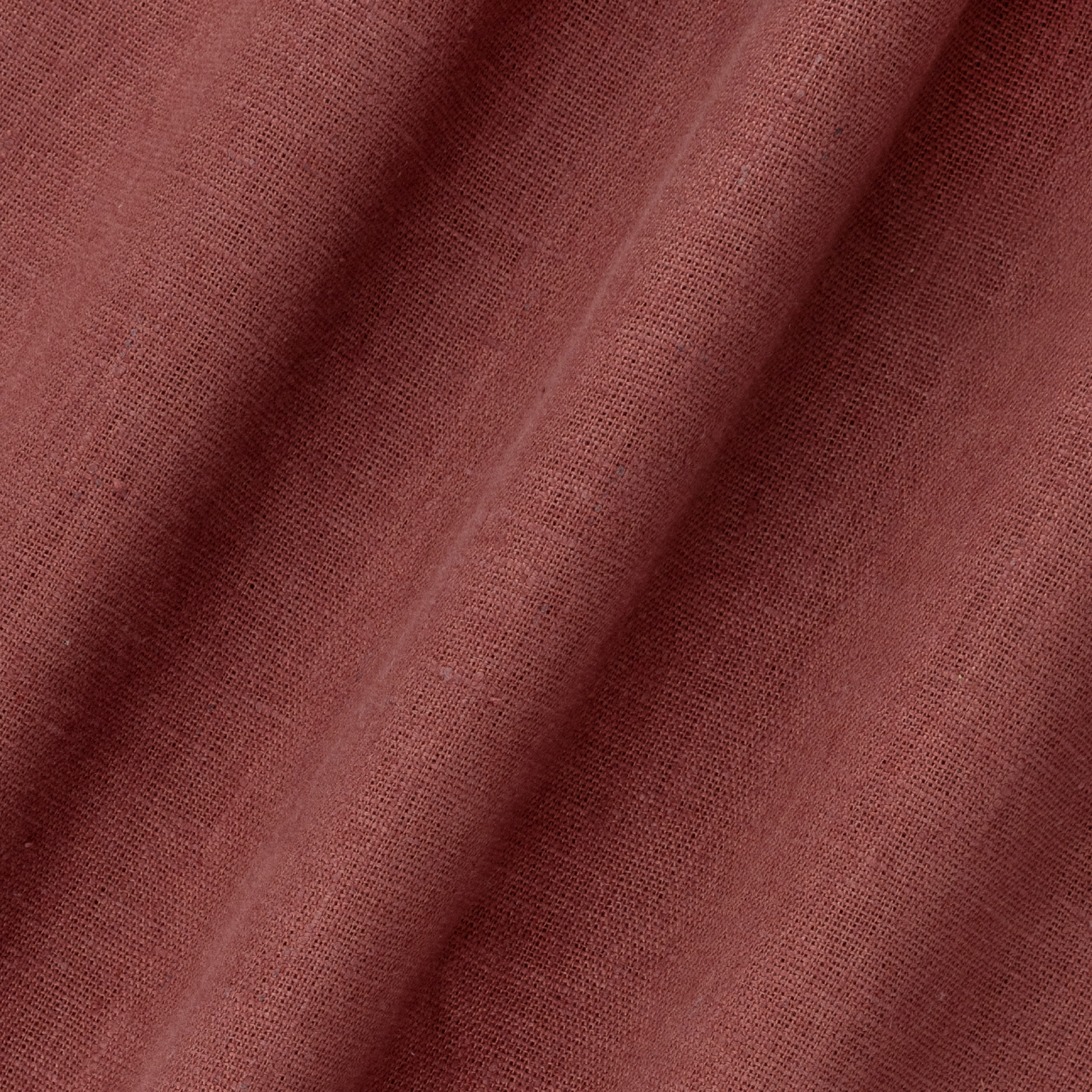 detail of light weight plain linen in marsala colour
