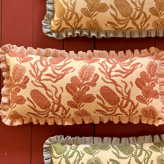 Cape botanical print cushion in terracotta with english rose frill