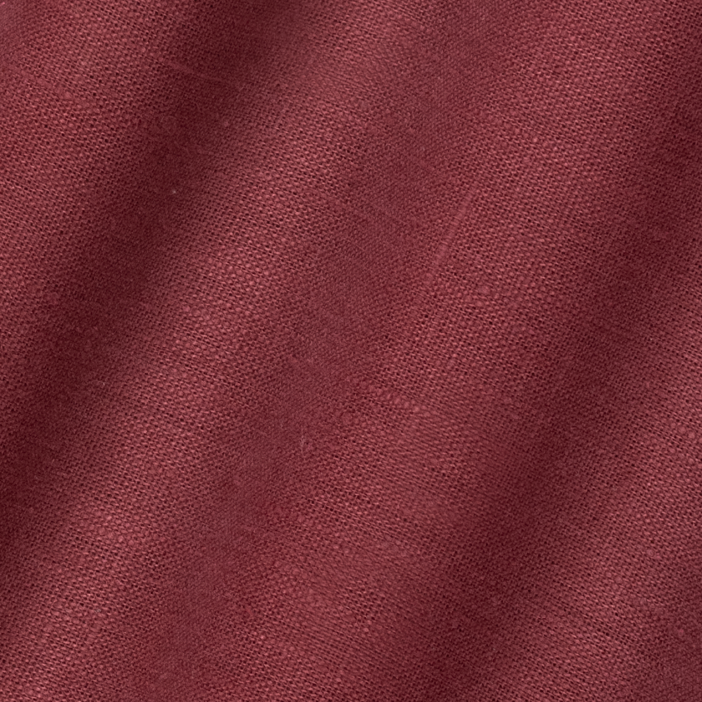 detail of light weight plain linen in scarlet colour