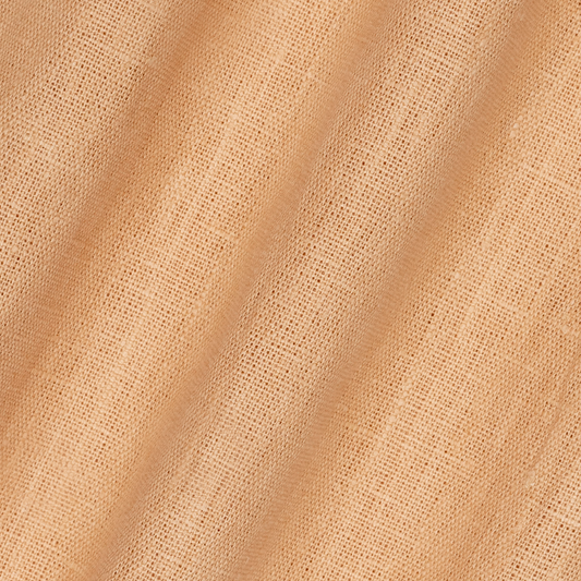 detail of light weight plain linen in peach colour