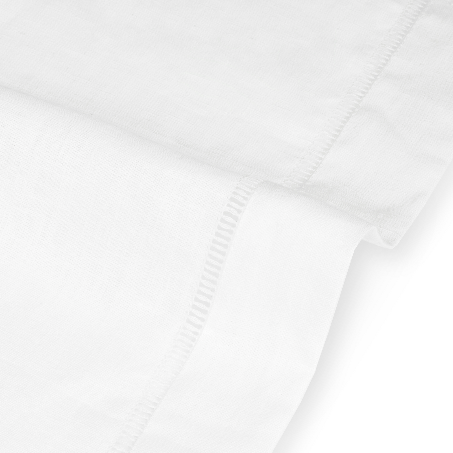 Close up detail of drawn thread lambrequin with ladder stitch edge in ivory white