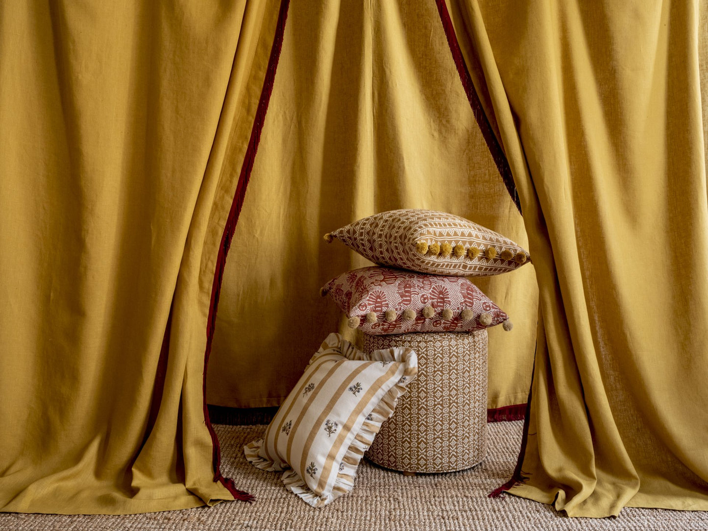 Sirin Print Cushion in Terracotta with Bobble Trim