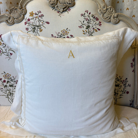 square pillowcase with ochre hemstitch with letter A embroidered at the top