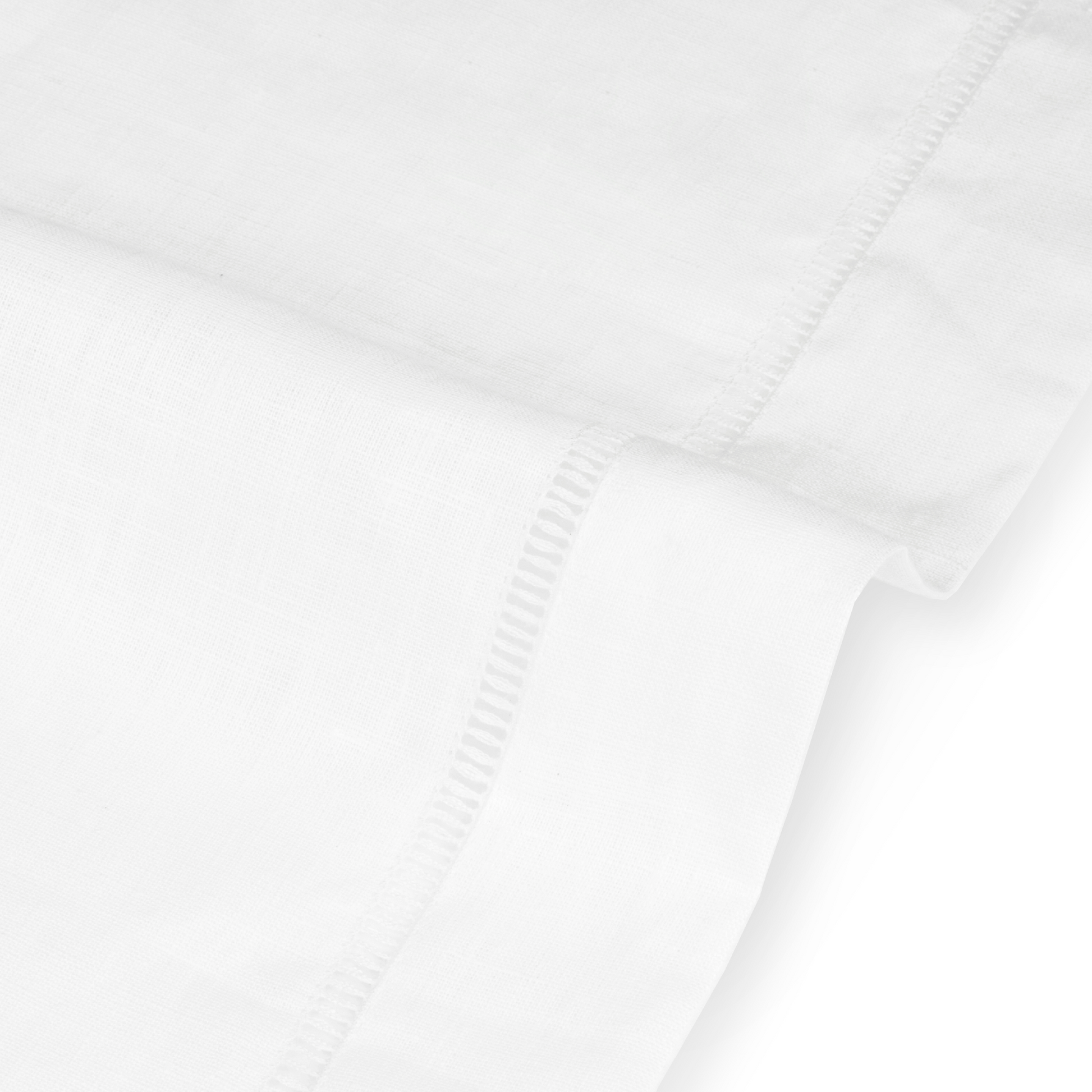 Close up detail of drawn thread lambrequin with ladder stitch edge in ivory white